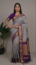 Load image into Gallery viewer, Woman wearing a gray and purple saree with gold border, posing in different angles.