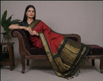 Load image into Gallery viewer, Woman wearing a red saree with black and gold border in various poses against a neutral background.