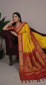 Load image into Gallery viewer, Woman wearing a yellow saree with red border in four different poses.