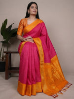 Load image into Gallery viewer, Woman wearing a pink and orange saree with a neutral background