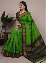 Load image into Gallery viewer, Green saree with black border worn by a model against a neutral background