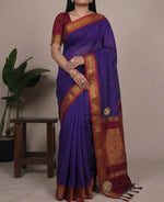 Load image into Gallery viewer, Woman wearing a purple saree with gold border in four different poses against a neutral background.
