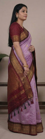 Load image into Gallery viewer, Woman wearing a purple saree with brown border in multiple poses against a neutral background