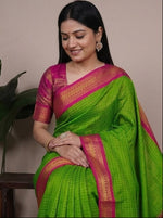 Load image into Gallery viewer, Green and pink saree with a person modeling it in different poses against a neutral background.