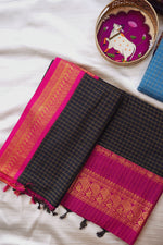 Load image into Gallery viewer, Black and pink checkered Gadwal Silk Cotton saree with a decorative plate in the background