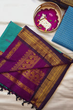 Load image into Gallery viewer, Purple and gold traditional fabric with a decorative plate and teal fabric on a white surface