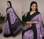 Load image into Gallery viewer, Woman wearing a purple and black saree with a plant in the background
