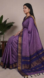 Load image into Gallery viewer, Purple saree with gold border displayed from multiple angles on a neutral background.