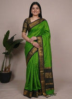 Load image into Gallery viewer, Green saree with black border worn by a model against a neutral background