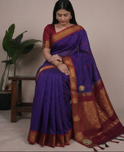Woman wearing a purple saree with gold border in four different poses against a neutral background.