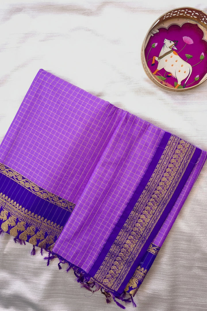 Purple checkered fabric with gold border on a white background, featuring 'deepashboutique.com'.